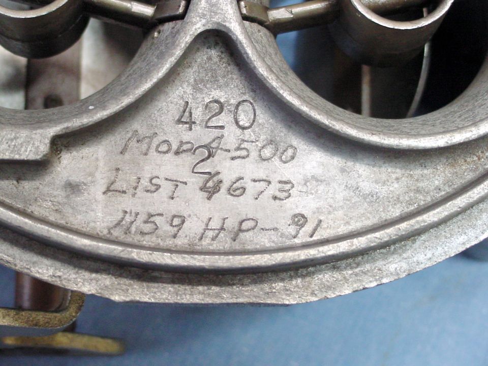 Metal part with stamped text: 420 Mod 2 500 List 4673 1159 HP-91