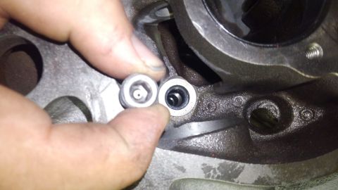 1996 Ford Bronco - this is an oil plug on the front of the block. the machine shop tapped the holes for threaded plugs to replace the press in plugs. i drille…