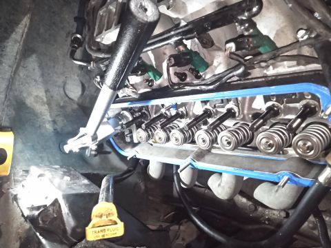 1996 Ford Bronco - using a air compressor to pressurize the cylinders and this valve spring compressor tool i managed to replace all the springs relatively ea…