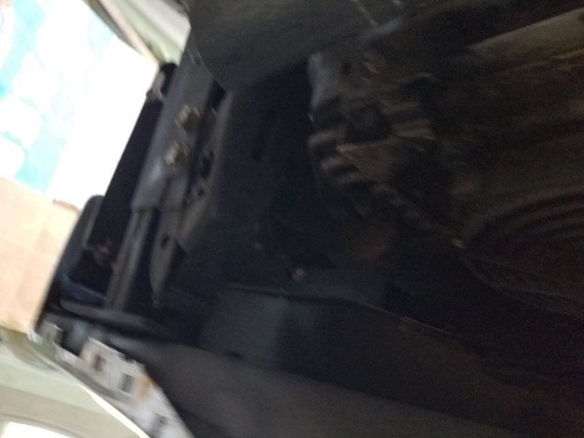 Underside view of a vehicle frame and suspension components.