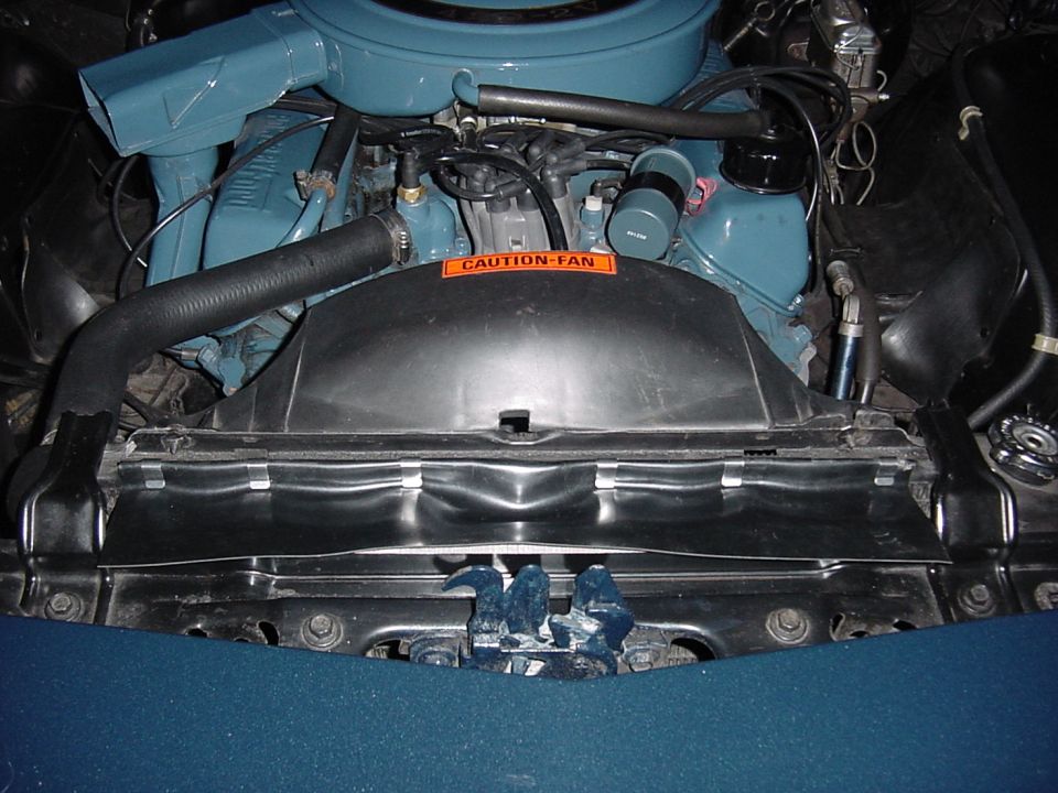 View showing the rubber shroud that was installed.  The original one was missing.  I'm not sure what exactly this does. Perhaps it forces fresh outside air to pass through the radiator, rather than being bypassed, by sucking air in from the large hole that exists just above and in front of the radiator when not covered, (see the first picture above,) which would be the engine compartment's ambient air temperature --surely warmer.