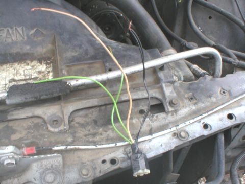 1987 Ford Crown Victoria LTD - Close-up view of exposed wiring and components within a vehicle's engine bay.