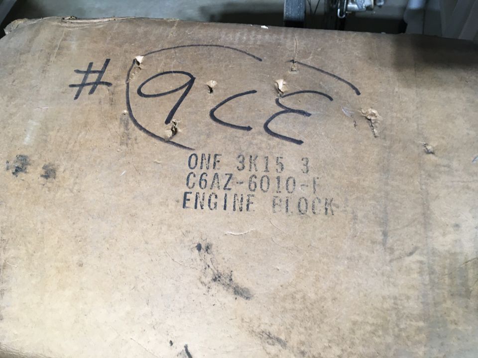 Cardboard box with '9CE' and 'ENGINE BLOCK' text