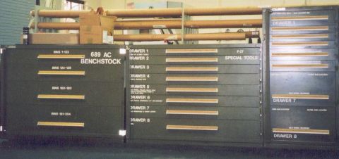 1988 Ford Bronco - Organized tool cabinets with labeled drawers and storage above.