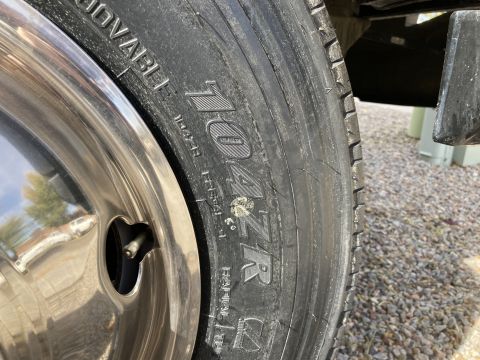 2015 Ford F-550 - A close-up view of a tire on a chrome wheel shows the brand name "TOYO" and "RADIAL" printed on the sidewall. The tire appears to be on a l…
