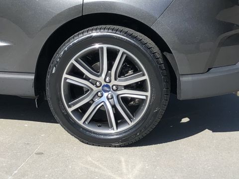 2019 Ford Everest - A close-up view of a vehicle's wheel and tire, showing the tread pattern and alloy rim.