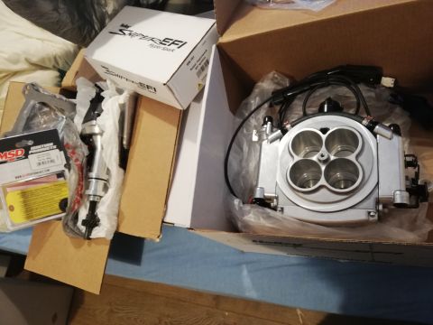 1996 Ford Bronco - Unboxed Holley Sniper EFI throttle body and MSD ignition components are shown, suggesting an engine upgrade project.