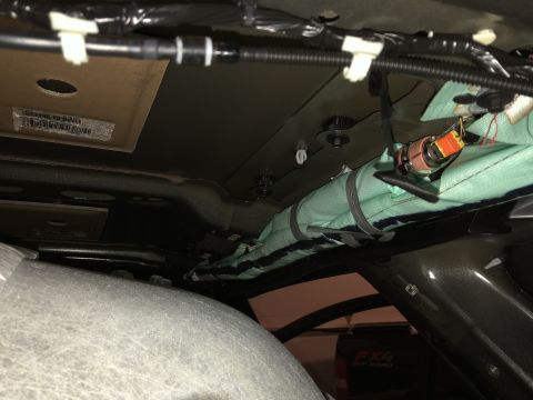 2019 Ford Everest - Close-up view of wiring and an airbag assembly inside a vehicle's interior.