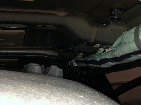 2019 Ford Everest - Close-up view of wiring and padding under a vehicle's body.