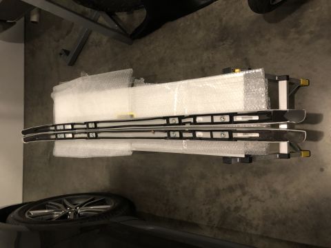 2019 Ford Everest - New roof rack rails are ready for installation, with a car wheel visible nearby.