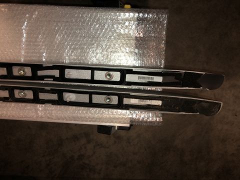 2019 Ford Everest - Two roof rack rails are shown, wrapped in protective packaging.