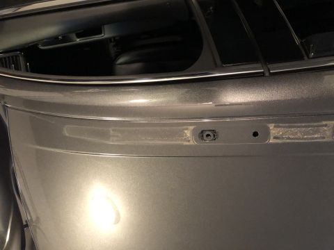 2019 Ford Everest - A close-up view of a vehicle's rear bumper, highlighting a sensor and mounting points.