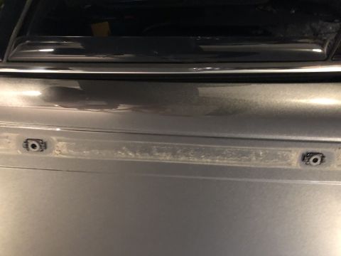 2019 Ford Everest - Close-up view of the rear bumper mounting points on a silver vehicle.