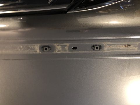 2019 Ford Everest - Detail of mounting hardware on a vehicle's exterior panel.