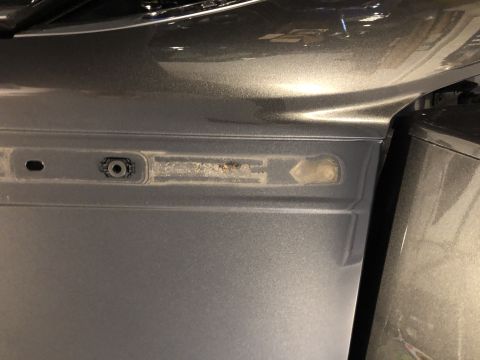 2019 Ford Everest - Detail of a vehicle's exterior panel, showing a mounting bracket and a weathered recessed area.