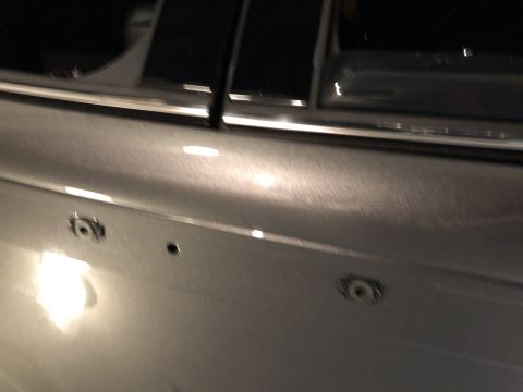 2019 Ford Everest - This image shows a section of a car's door panel with visible mounting holes.
