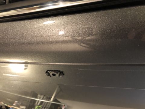 2019 Ford Everest - Close-up of a car's body panel, showing a mounting clip and trim.