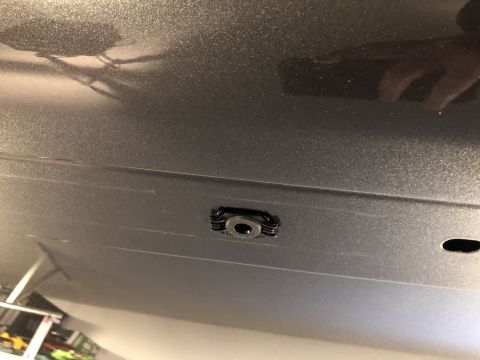 2019 Ford Everest - A close-up view of a mounting point on the underside of a vehicle, possibly for a roof rack attachment.