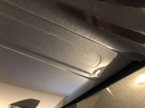 2019 Ford Everest - Close-up view of a gray metallic roof rack mounting point, showing embossed lines and textured paint.