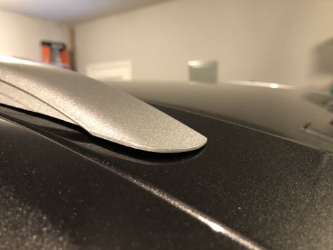 2019 Ford Everest - A silver roof rack piece is shown attached to the top of a dark-colored vehicle.