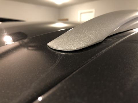 2019 Ford Everest - Detail of a roof rack rail attached to a vehicle's roof.