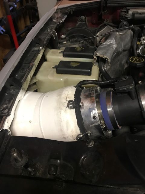 2000 Ford Explorer - Custom intake tube installed in the engine bay, obscuring the original components.