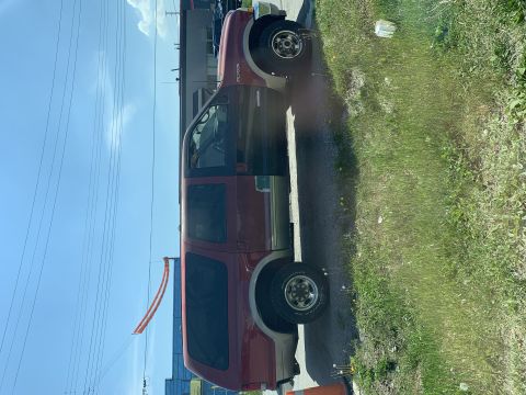 2002 Ford Excursion - This Ford Excursion appears to be from the early 2000s, with its distinctive body style visible from the side.