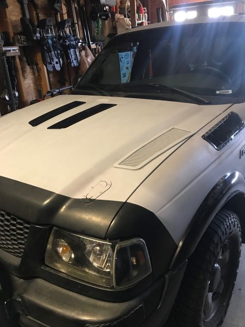 2000 Ford Explorer - Front view of a white Ford Ranger, likely from the early 2000s, in a garage.