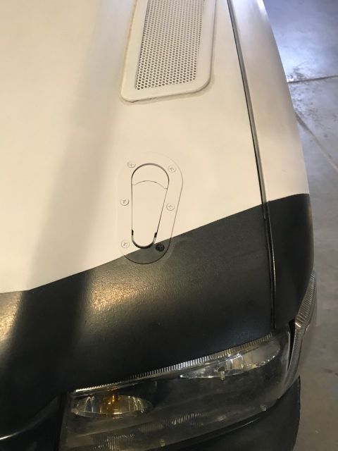 2000 Ford Explorer - A quick-release hood latch is installed on the vehicle's hood.