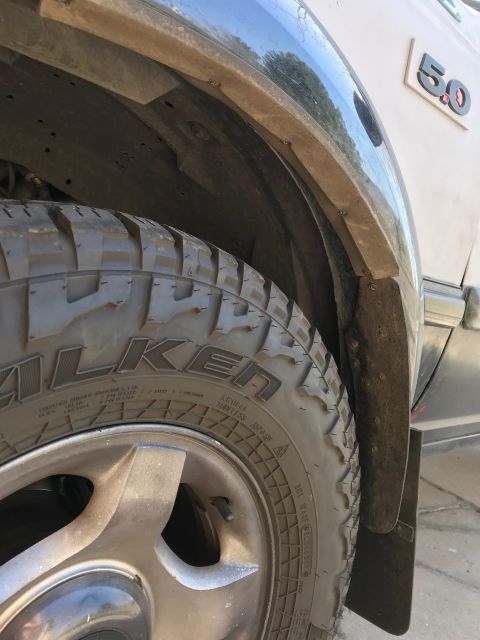 2000 Ford Explorer - A "5.0" badge is visible on the side of the vehicle, near the rear wheel well and mud flap.