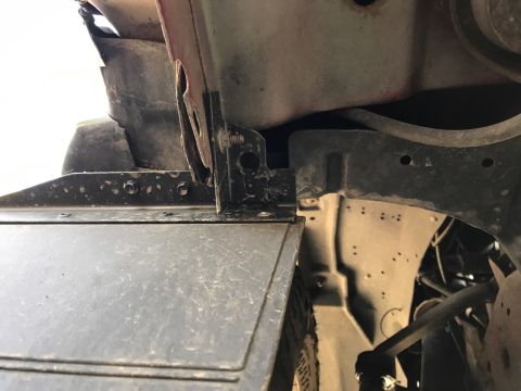 2000 Ford Explorer - Undercarriage view shows a metal bracket attached to a vehicle's frame.