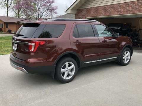 2016 Ford Explorer - This 2016 Ford Explorer is parked in a driveway, showing its rear and side profile.
