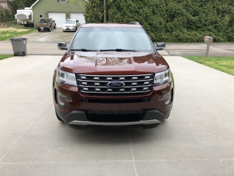 2016 Ford Explorer - The front grille and Ford badge are clearly visible on this maroon SUV.