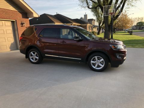 2016 Ford Explorer - Maroon Ford Explorer parked in a suburban driveway.