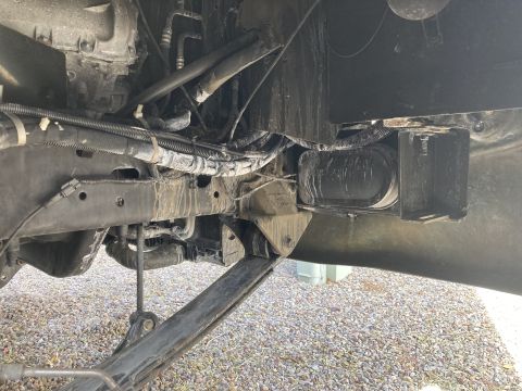 2015 Ford F-550 - Close-up view of the underbody chassis and suspension system, showing various mechanical parts and wiring harnesses.