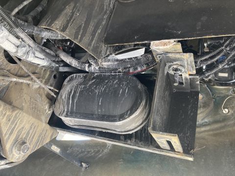 2015 Ford F-550 - Vehicle chassis wiring and battery housing detail.