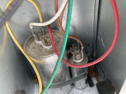 2015 Ford F-550 - Close-up view of electrical capacitors and wiring within a metal enclosure.