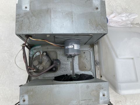2015 Ford F-550 - Interior view of a Coleman Mach air conditioner unit, showing the fan and motor components.