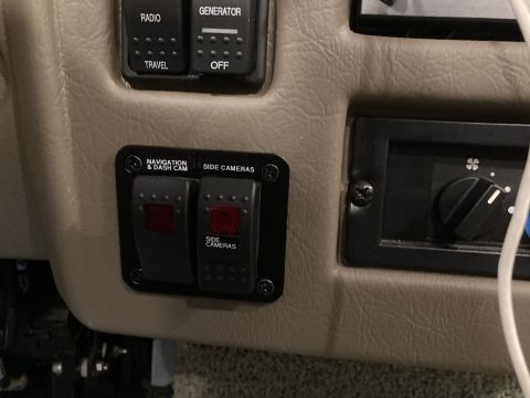 2015 Ford F-550 - Close-up of a vehicle's interior control panel buttons for various functions and a climate control dial.