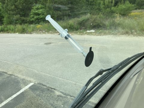 2015 Ford F-550 - A windshield repair kit is shown attached to the glass, ready for use.