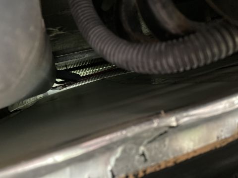 2015 Ford F-550 - Close-up view of a vehicle's radiator and associated hoses, showing mechanical components.