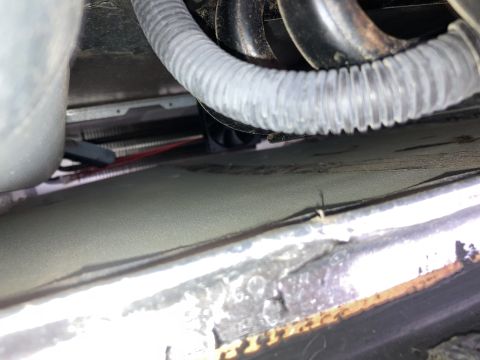 2015 Ford F-550 - The image shows a close-up view of a refrigerator's cooling unit, including fins and a fan.