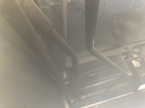 2015 Ford F-550 - Close-up view of pipes and wiring, likely from a refrigerator unit.
