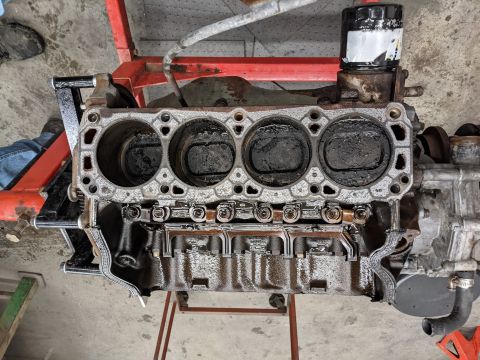 1996 Ford Bronco - Heads Removed. Tons of Carbon deposits. Possibly due to EGR and Smog pump delete. Very dirty, but no measurable wear! We'll stick to honing…