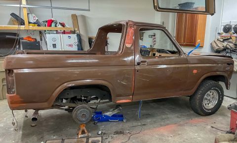 1984 Ford Bronco - This 1984 Ford Bronco is in a garage, appearing to be in the middle of a restoration project.