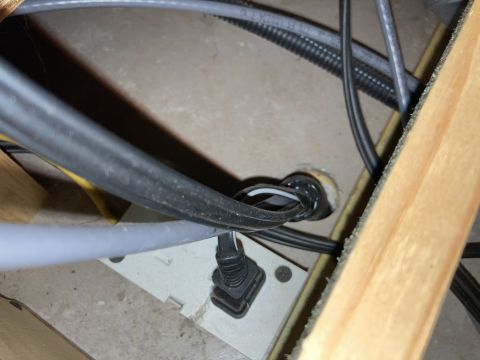2015 Ford F-550 - Close-up of electrical wiring and a junction box, surrounded by wooden framing.