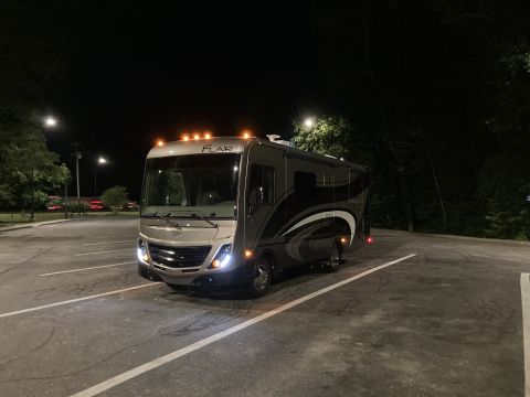 2015 Ford F-550 - This RV motorhome, identified by the FLAIR badge, is seen parked outdoors at night.