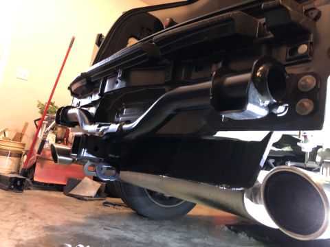 2019 Ford Everest - Tow hitch receiver and exhaust pipe assembly shown from the rear.