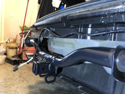 2019 Ford Everest - Close-up of a vehicle's tow receiver hitch and wiring harness.