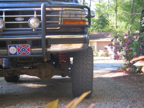 1995 Ford Bronco - Ford Bronco front end with bull bar and Confederate flag plate.